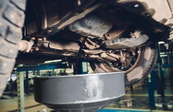 Service of trucks. Oil change in service center. waste oil drain